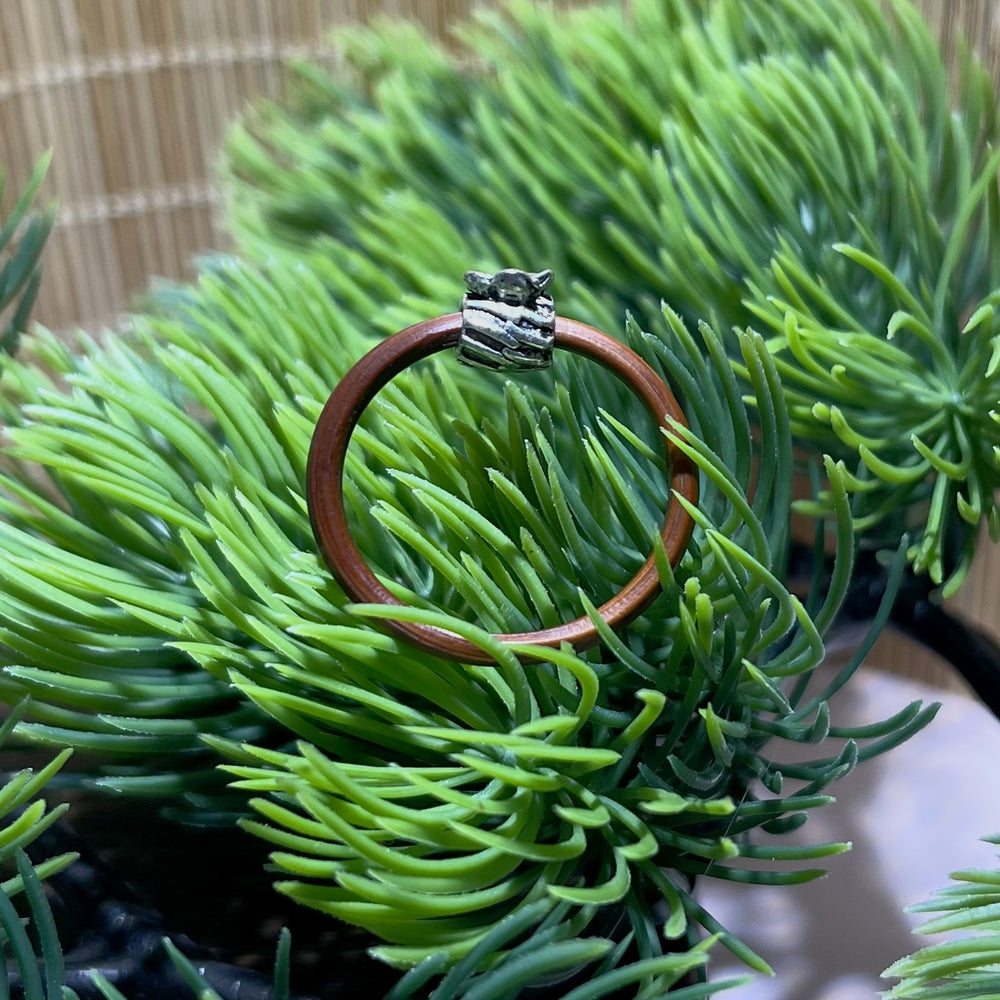 Side view of the Lucky Purse Flower Vine Ring showing the coin-purse shaped silver charm